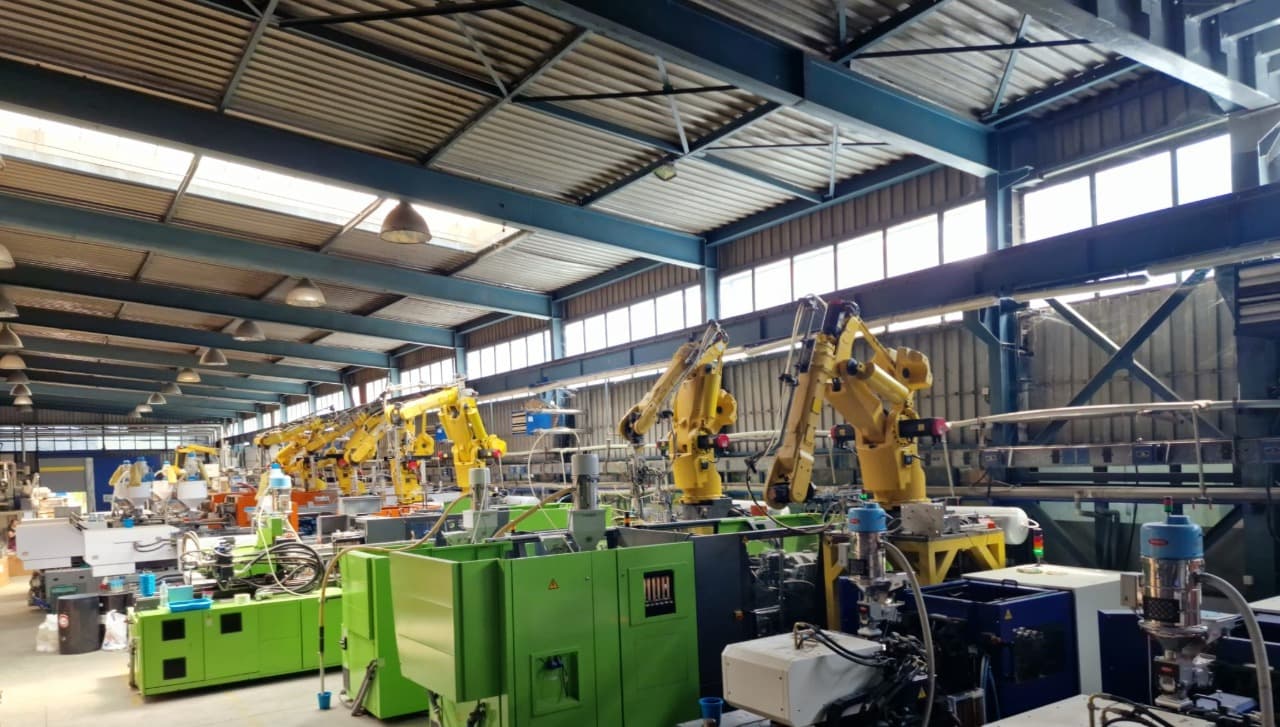 Robotic manufacturing equipment operating inside the Dema-Stil factory